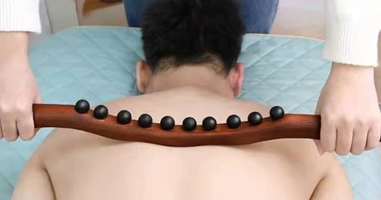 Wooden massage stick for lymphatic drainage