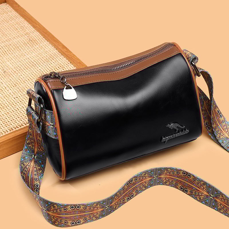 Versatile shoulder bag with wide shoulder strap for women